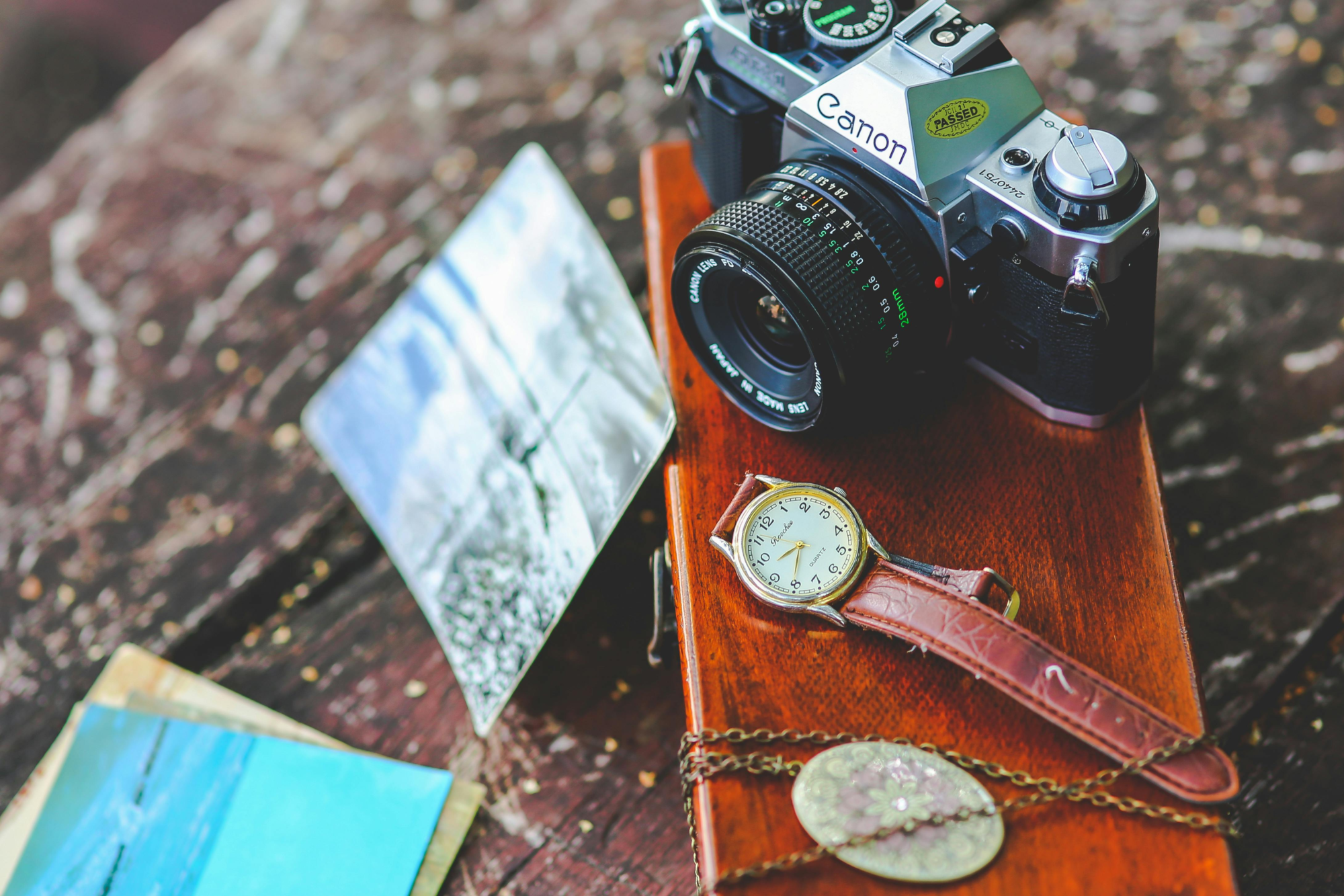 camera on desk with watch